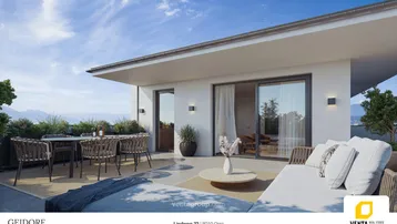 Geräumige Dachterrasse mit Lounge-Möbeln, Essbereich und weitem Blick auf die umliegende Landschaft.