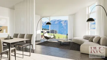 Helles, modernes Wohn-Esszimmer mit großen Fenstern, die einen atemberaubenden Blick auf den See und die Berge bieten.