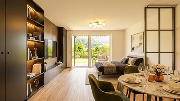 Helles, modernes Studio-Apartment mit offenem Wohnbereich, Essplatz und Zugang zum Garten mit Bergblick.