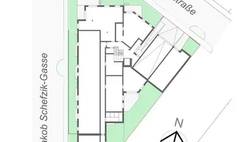 Lageplan des Gebäudekomplexes mit angrenzenden Straßen und Grünflächen.