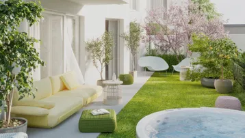 Moderne Gartenterrasse mit bequemen Sitzgelegenheiten, Whirlpool und blühenden Bäumen für entspannte Stunden im Freien.