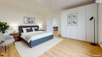 Helles Schlafzimmer mit modernem Bett, Einbauschränken und Holzboden, mit Zugang zu einem weiteren Raum.