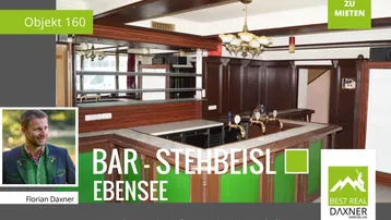 Traditionelle Bar mit Holzbalken und Zapfanlage, gut gepflegt und einladend für Gäste.