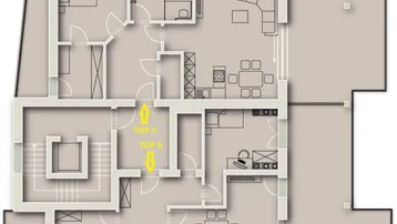 Grundriss einer Etage mit zwei Wohnungen, jeweils mit Schlafzimmern, Bädern und offenem Wohnbereich.
