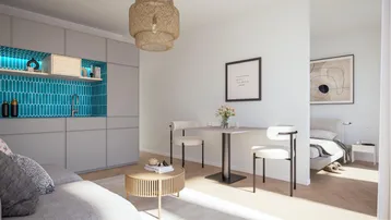 Modernes Studio-Apartment mit integrierter Küchenzeile, Essbereich und Schlafbereich in hellem Design.