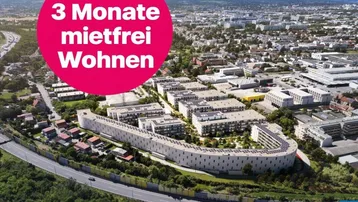 Luftaufnahme eines modernen Wohnkomplexes mit Solaranlagen und Werbebotschaft für mietfreies Wohnen.