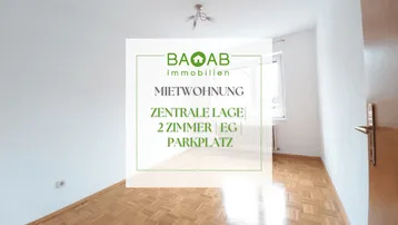 Helles Zimmer mit Parkettboden und Fenster, ideal für eine Mietwohnung in zentraler Lage.