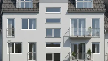 Moderne Gebäudefassade mit Balkonen, großen Fenstern und Satteldach.