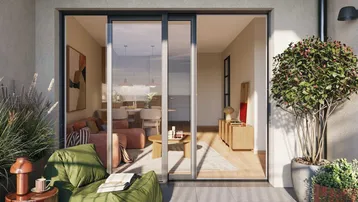 Moderne Terrasse mit bequemen Sitzmöbeln und Zugang zu einem hellen Wohnbereich.