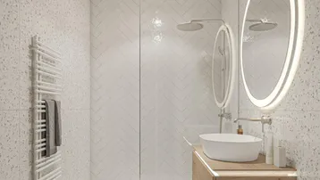 Modernes Badezimmer mit begehbarer Dusche, schwebendem Waschtisch und beleuchtetem Spiegel.