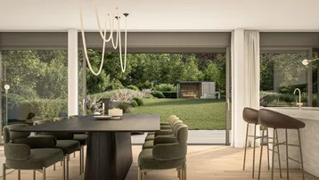 Moderner Essbereich mit großem Tisch, Samtstühlen und Blick in den grünen Garten.