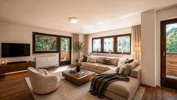 Helles Wohnzimmer mit gemütlichem Sofa, Holzboden und Zugang zu einem Balkon, modern eingerichtet.