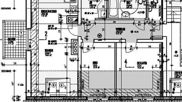 Grundriss einer Wohnung mit offenem Wohnbereich, zwei Schlafzimmern, zwei Bädern und Balkon.