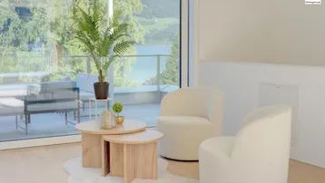Helles Wohnzimmer mit modernen Möbeln, Holzboden und weitem Blick auf den See und die Berge.