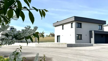 Außenansicht des Hauses mit blühenden Bäumen im Vordergrund und ländlicher Umgebung.