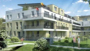 Modernes Mehrfamilienhaus mit hellen Fassaden, großzügigen Balkonen und einer gepflegten Grünanlage.