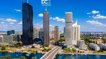 Luftaufnahme der Wiener Skyline mit modernen Wolkenkratzern, Fluss und Brücke bei Tag.