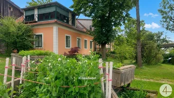 Charmantes Landhaus mit oranger Fassade, grünen Fensterläden und einem gepflegten Gartenbereich mit Hochbeet.
