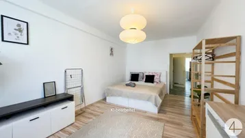 Helles Schlafzimmer mit modernem Bett, offenem Holzregal und praktischem Wäscheständer.