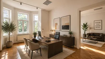Geräumiges Büro mit modernem Schreibtisch, bequemen Stühlen und Blick in einen angrenzenden Wohnbereich.