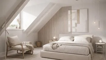 Helles Schlafzimmer im Dachgeschoss mit schrägen Wänden, Holzakzenten und modernem Design.