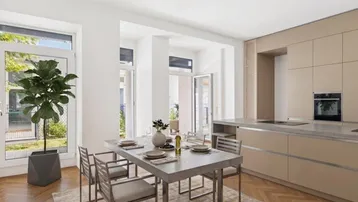 Moderne Küche mit beigen Schränken, Essbereich und Zugang zum Außenbereich.