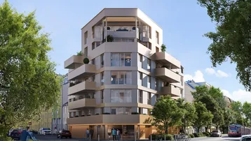 Moderne Wohnanlage mit mehreren Balkonen und Geschäften im Erdgeschoss in städtischer Umgebung.