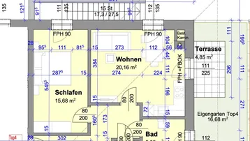 Grundriss einer Wohnung mit Wohnzimmer, Schlafzimmer, Bad und Terrasse sowie eigenem Gartenanteil.