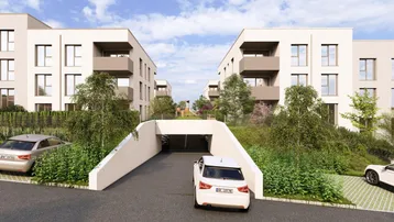 Zufahrt zur Tiefgarage zwischen zwei modernen Wohngebäuden mit Grünflächen.