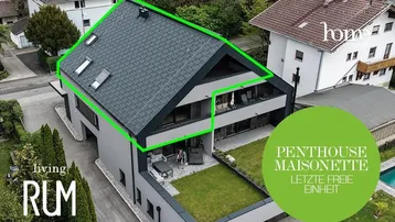 Moderne Penthouse-Maisonette mit Flachdach, Balkonen und einer begrünten Dachterrasse in städtischer Umgebung.