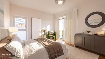 Helles Schlafzimmer mit Doppelbett, modernem Dekor und Zugang zum Balkon.