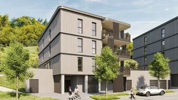 Moderne Wohnanlage mit schlichter Fassade, Balkonen und begrüntem Eingangsbereich an einer Straße.