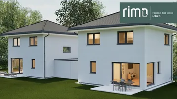 Moderne Doppelhaushälfte mit großen Fenstern und Terrasse im Grünen.