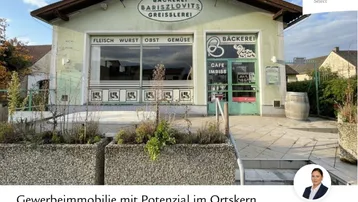 Vorderansicht einer Gewerbeimmobilie mit Bäckerei, Café und Greisslerei im Ortskern von Müllendorf.