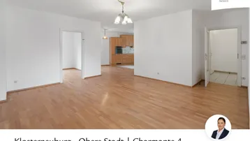 Geräumiger, heller Wohnbereich mit Parkettboden und Zugang zu weiteren Räumen, ideal für individuelle Gestaltung.