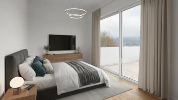 Helles Schlafzimmer mit Zugang zu einer Terrasse, modernen Möbeln und weitem Ausblick.