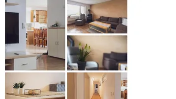Gemütliches Wohnzimmer mit Sofa, Sessel, kleinem Ofen und hellem Flur.