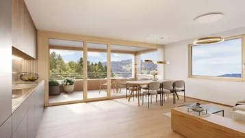 Geräumiger Wohn-Essbereich mit moderner Küche, Holzboden und großzügigem Zugang zur Terrasse mit Weitblick.