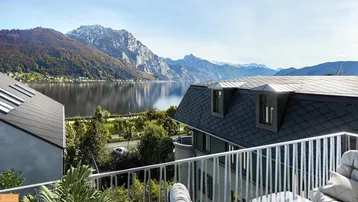 Blick vom Balkon auf den See und die umliegenden Berge mit bequemen Sitzgelegenheiten.