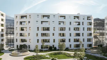 Moderne Wohngebäude mit heller Fassade, großen Fenstern und einem ansprechend gestalteten Innenhof.