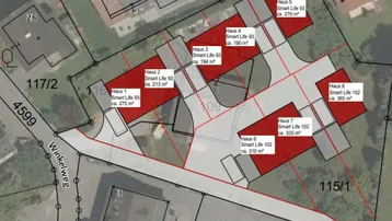 Katasterplan mit eingezeichneten Baugrundstücken und geplanten Gebäuden in einer Wohnsiedlung.