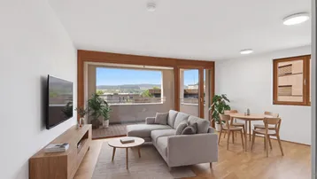 Helles Wohn- und Esszimmer mit Holzboden, bequemer Couch und Zugang zum Balkon mit Weitblick.