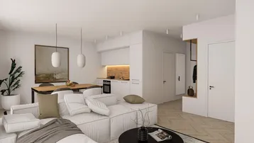 Offener Wohnbereich mit integrierter Küche, Esstisch und gemütlichem Sofa.