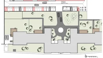 Übersichtsplan des Gebäudekomplexes mit Parkplätzen, Grünflächen und einem Spielplatz.