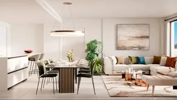 Helles, offenes Wohn-Esszimmer mit integrierter Küche, großen Fenstern und Meerblick.