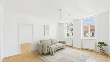 Helles Wohnzimmer mit modernem Sofa, Holzboden und Blick auf die umliegenden Gebäude.