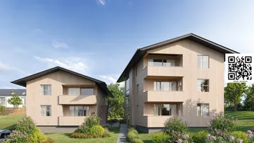 Moderne Mehrfamilienhäuser mit Holzfassade und Balkonen in grüner Umgebung.