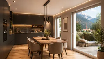 Moderne offene Küche mit Essbereich, Holzboden und Bergblick durch große Fenster.
