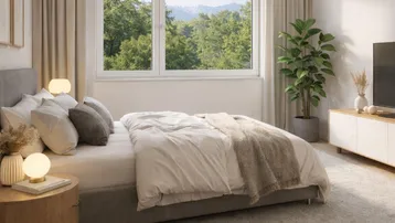 Helles Schlafzimmer mit gemütlichem Bett, modernen Nachttischen und Bergblick durch das Fenster.