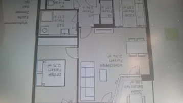 Detaillierter Grundriss einer Wohnung mit Wohnzimmer, Schlafzimmer, Bad, separatem WC und Loggia.